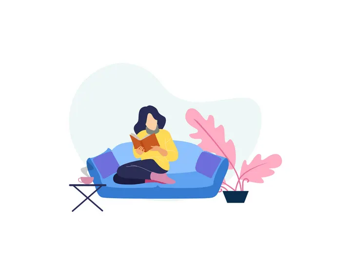 A girl reading  book on sofa