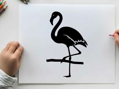 Silhouette of a flamingo standing on one leg