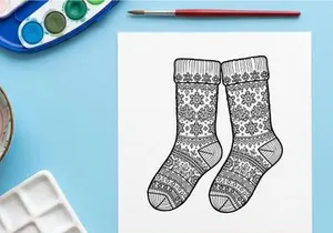 Christmas socks line art illustration with snowflake patterns for holiday coloring page