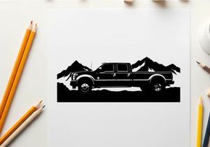 Black silhouette pickup truck in front of mountain range silhouette