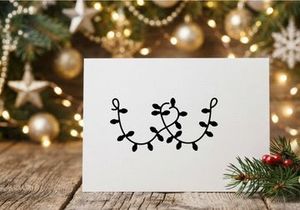 Black silhouette of Christmas string lights isolated on a white background