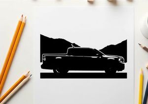 Silhouette of a pickup truck against a mountain range silhouette