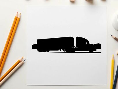 Silhouette of a semi truck driving on the road with mountains