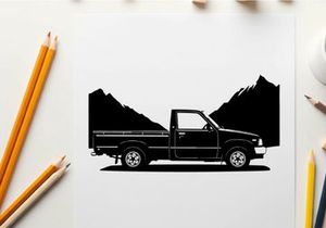 Silhouette of a pickup truck in front of mountains