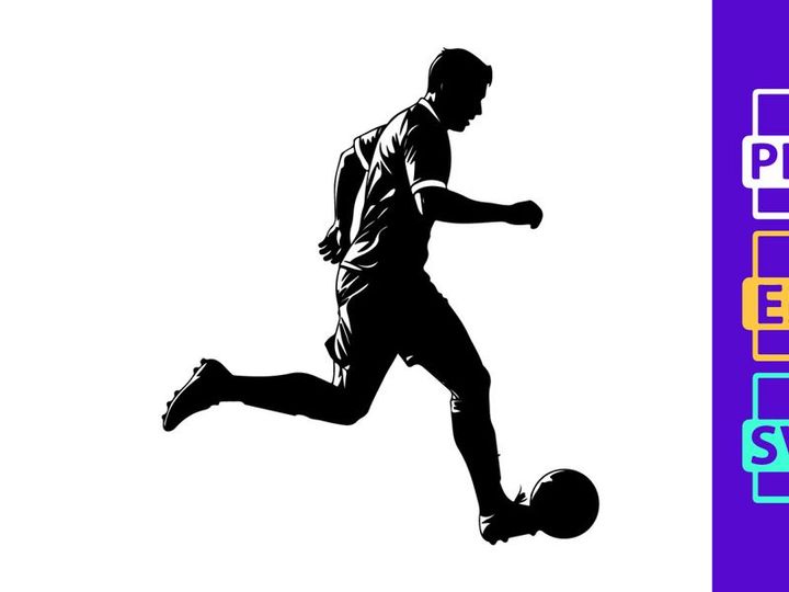 Silhouette of a soccer player kicking a ball in mid action