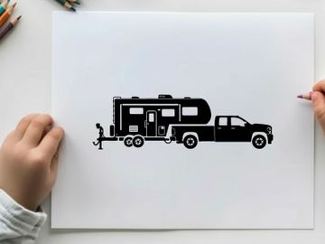 Silhouette of a pickup truck towing a large rv preview picture