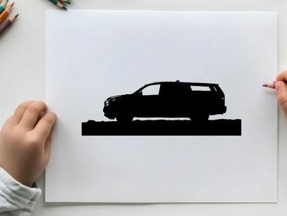 Silhouette of a car in front of mountains