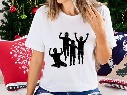 Silhouette of four joyful children celebrating with raised arms in unison