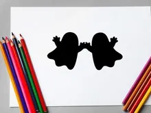 Silhouette of two children holding hands, playful and joyful scene