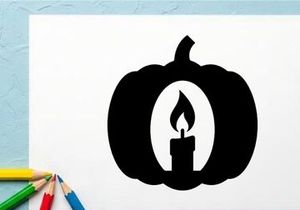 Silhouette labu dengan lilin menyala di dalam untuk dekorasi Halloween