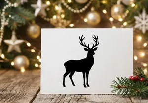Black silhouette of a majestic reindeer with large antlers isolated on white background