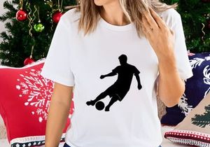 Soccer player kicking a ball in dynamic motion on the field