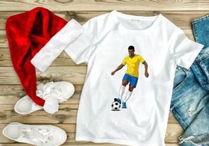 A soccer player in a yellow jersey skillfully kicking a ball on a plain white background