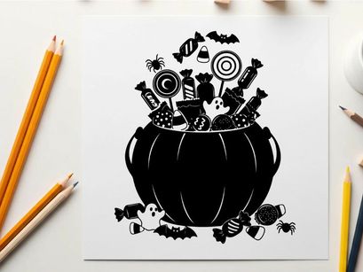 Halloween candy in a cauldron silhouette with treats