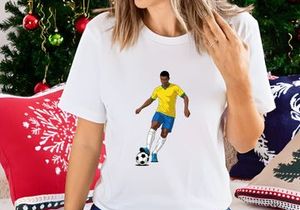 A soccer player in a yellow jersey skillfully kicking a ball on a plain white background