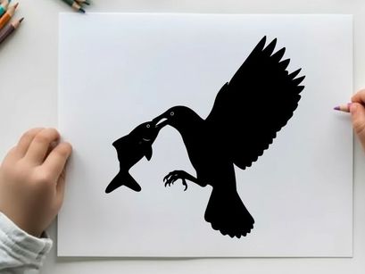 Silhouette of a bird catching a fish in mid air