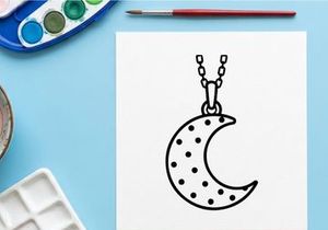 Crescent moon pendant necklace with star polka dots. Celestial minimalist jewelry for Halloween or gothic fashion styling.