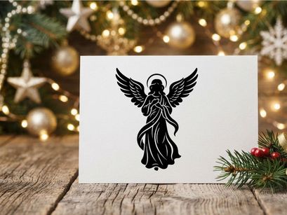 Black silhouette of a Christmas angel with wings and halo on a white background