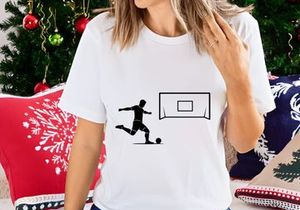 Soccer player kicking ball towards goal in a dynamic motion