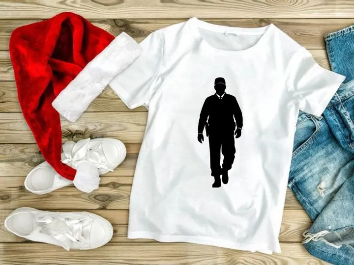 A black silhouette of a police officer walking towards the viewer on a white background