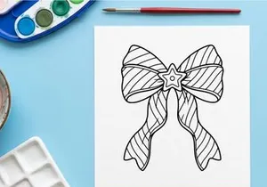 Christmas bow coloring page with star ornament for holiday activity and festive decoration.