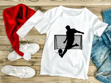 Soccer player kicking ball in front of goal net in action preview picture