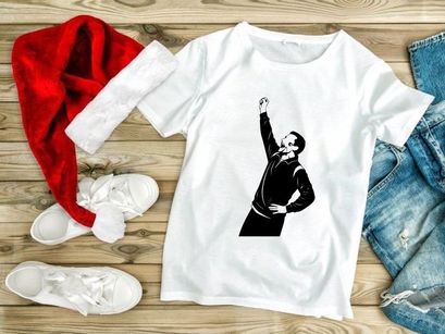 A man in a tracksuit throwing his fist up in the air with excitement or defiance