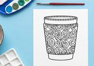 Elegant white and gold Christmas whiskey glass with ornate festive swirl pattern design