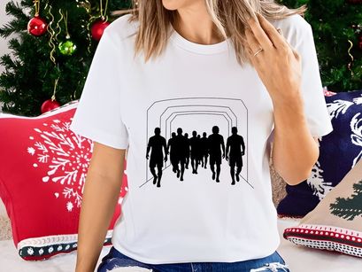 Silhouettes of people running through a tunnel