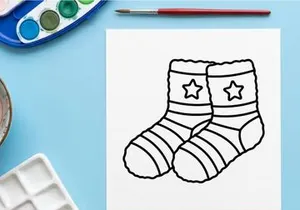 Pair of cartoon Christmas socks with stars for festive holiday gift or celebration