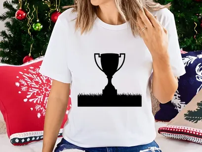 A black silhouette of a trophy cup on a grassy field with white background