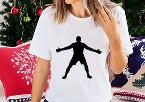 A silhouette of a man standing with arms outstretched in a dynamic pose
